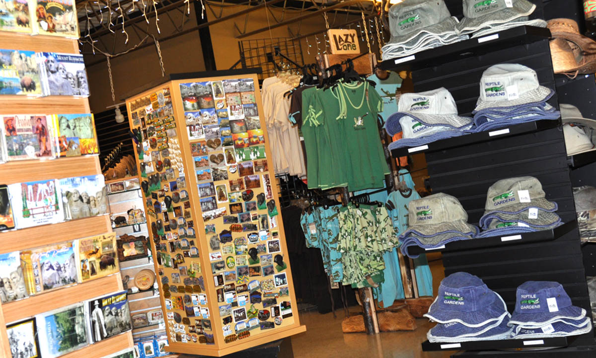 Image of the Reptile Gardens Gift Shop, showcasing magnets, post cards, hats, and apparel.